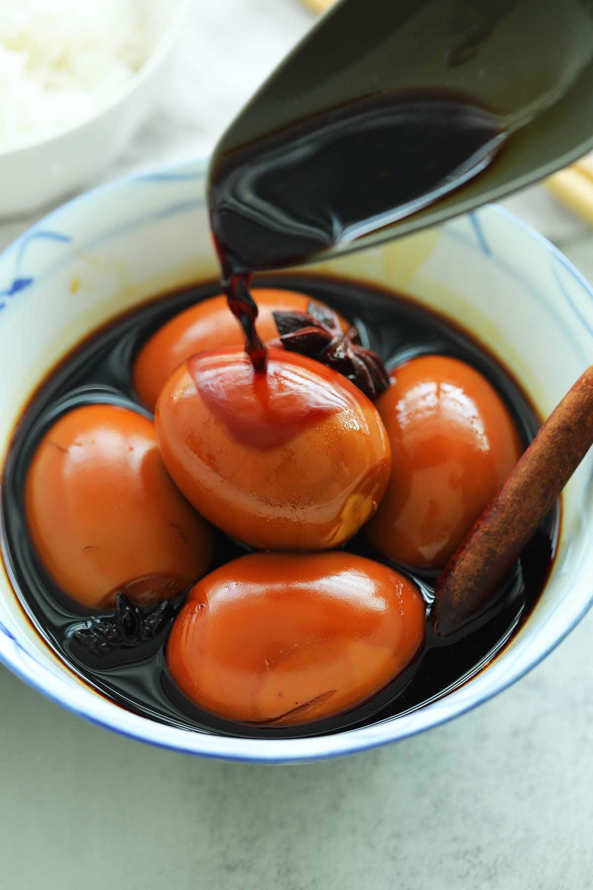 Delicious brown hard boiled eggs in soy sauce in a bowl. 