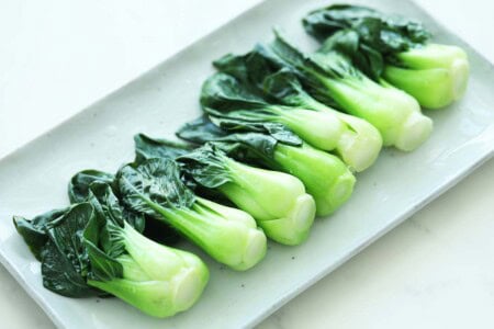 Blanched Chinese greens on a plate.