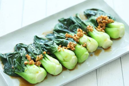 Chinese greens with oyster sauce and topped with garlic oil, ready to serve. 