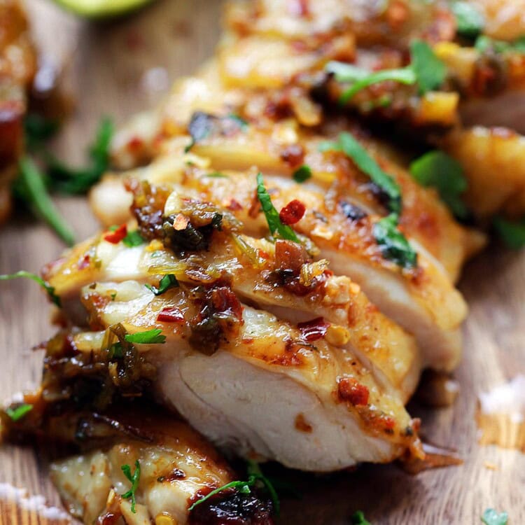 Grilled cilantro lime chicken served with lime wedges.