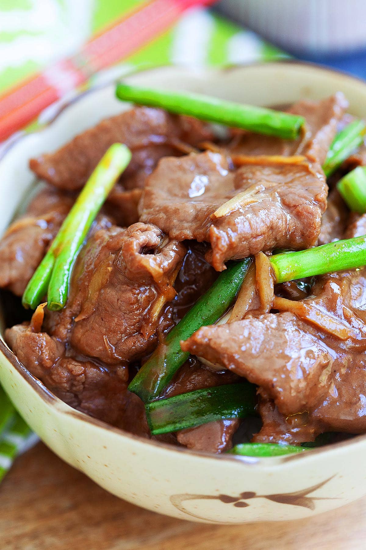Tender ginger beef topped with green onion.