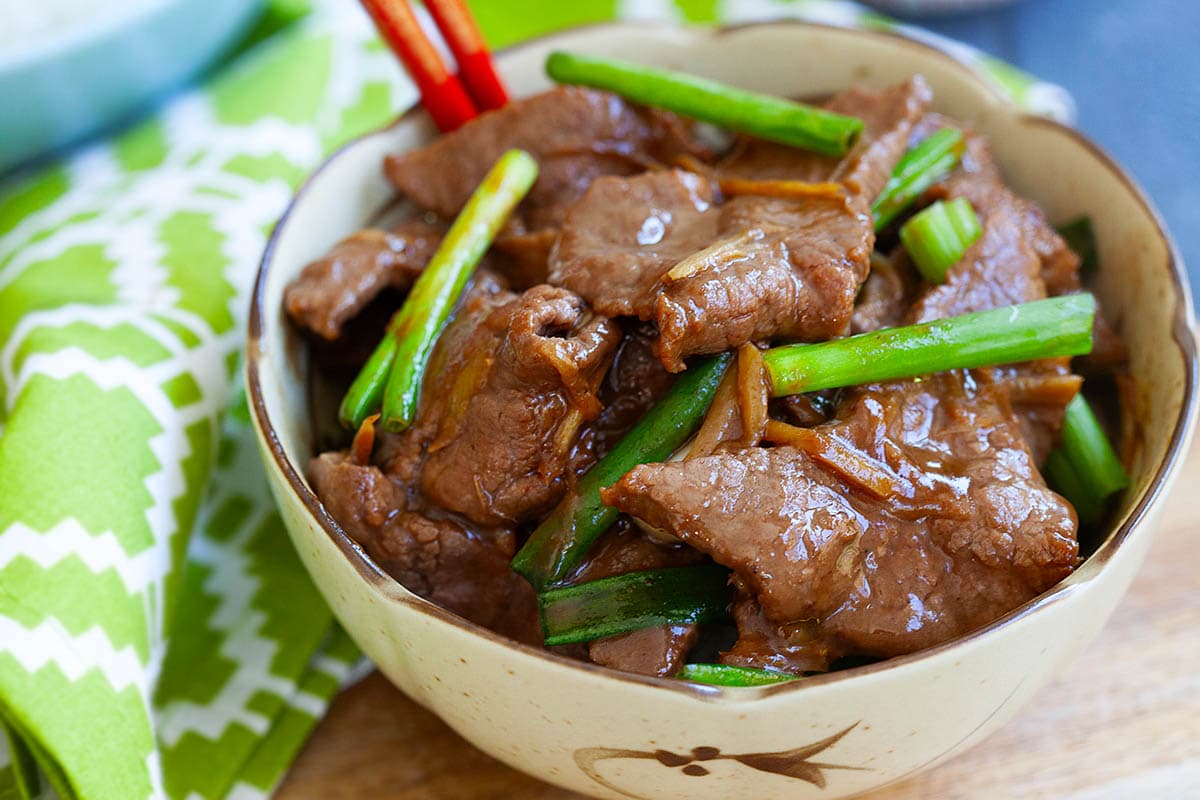 Scallion beef stir fry with ginger served in a bowl. 