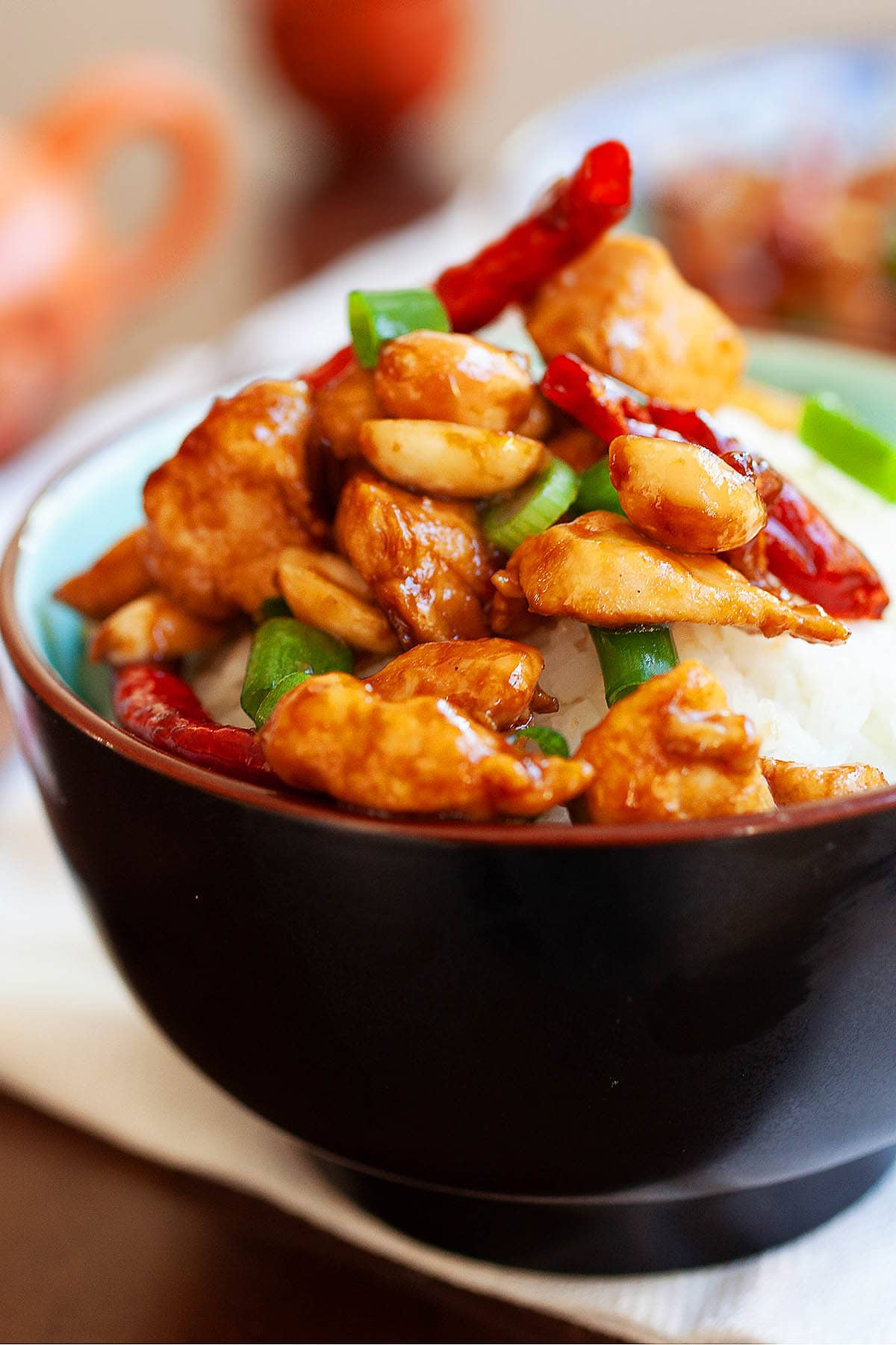 Simple kung pao chicken recipe with tender chicken, red chilies, peanuts in a spicy Szechuan kung pao sauce. 