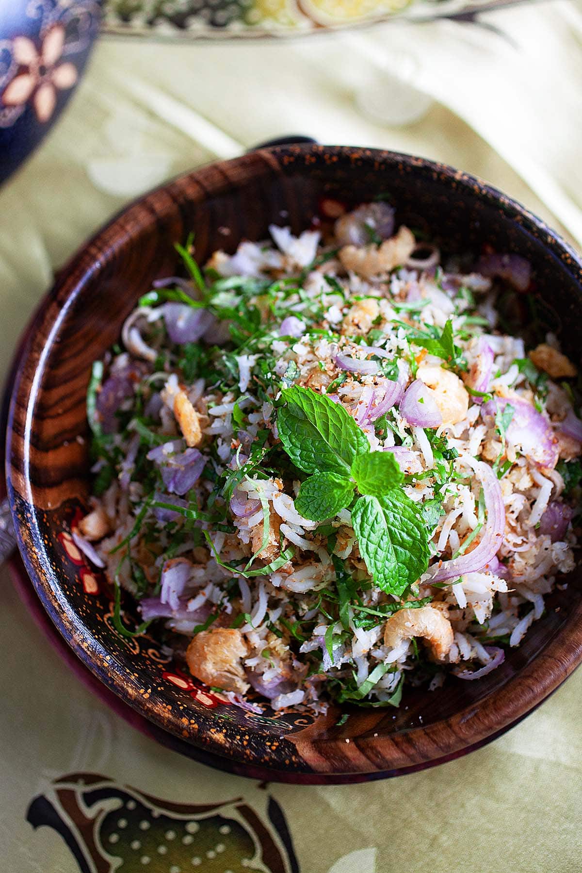 Herbed rice with mint leaves and fresh herbs served in a bowl. 