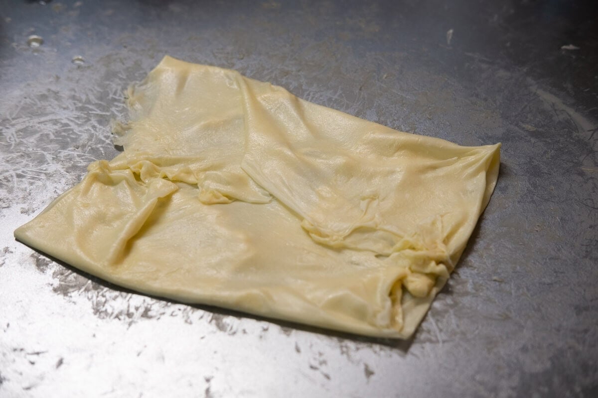 Fold the paper thin dough into a square. 