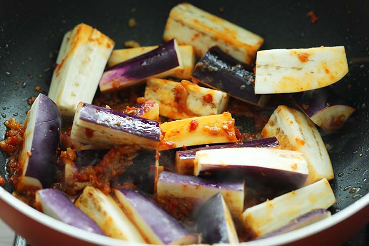 Eggplant added into the wok with sambal and dried shrimps.