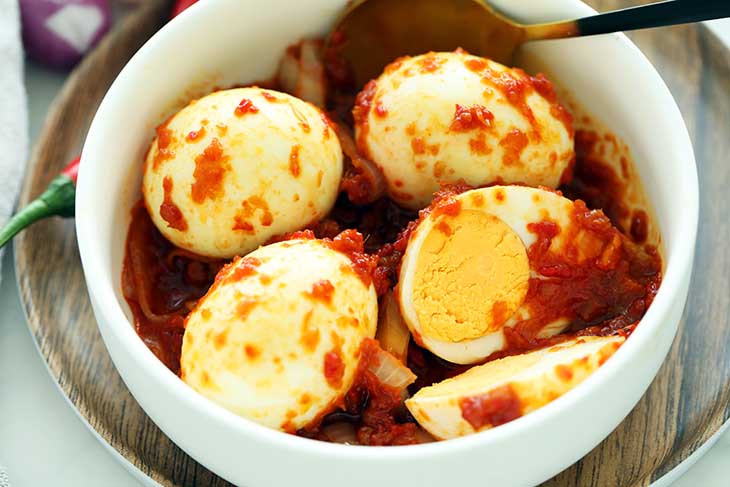 Fragrant and delicious sambal telur served in a bowl.