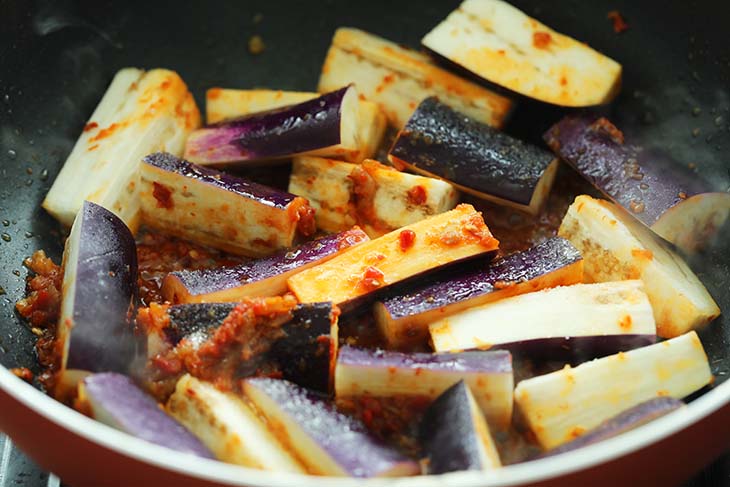 Fish sauce and Sugar is added into the wok with the eggplant.