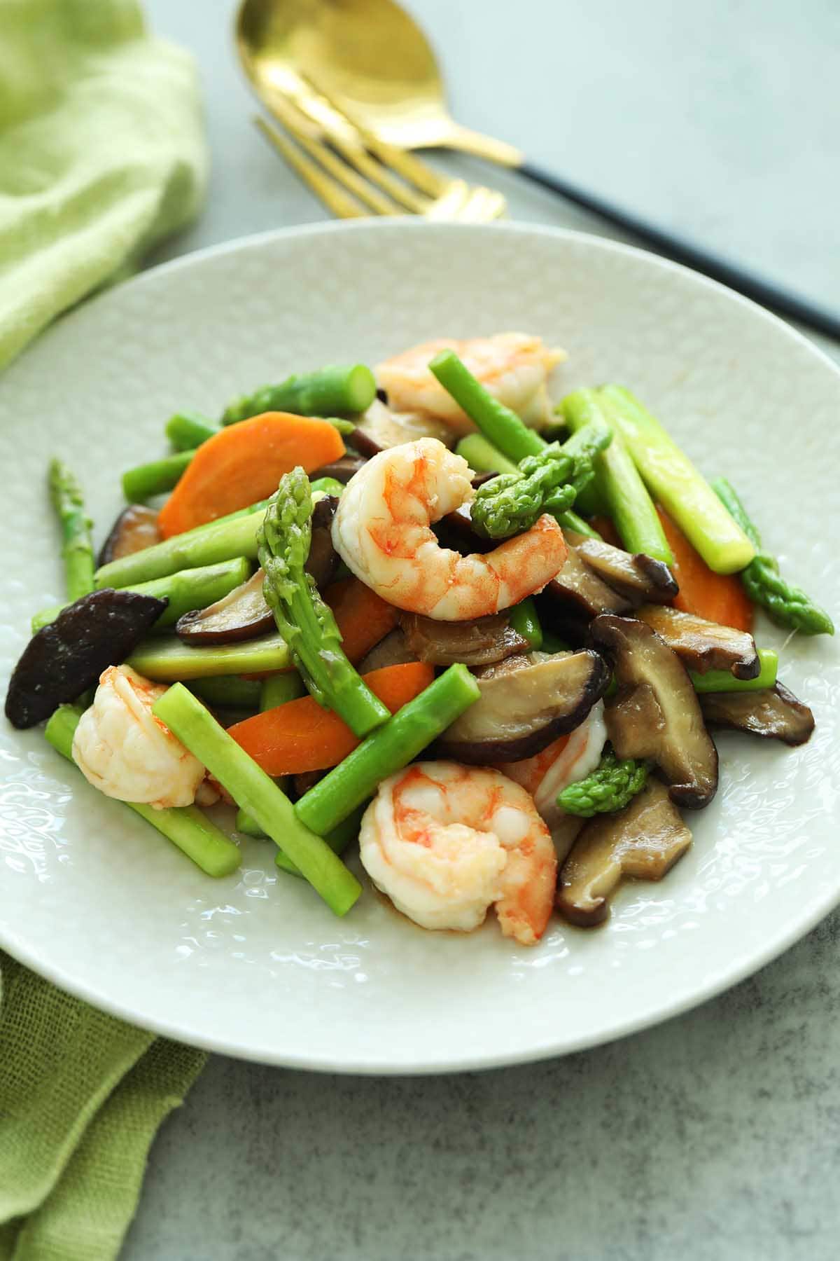 Easy and healthy Chinese asparagus dish with brown sauce.