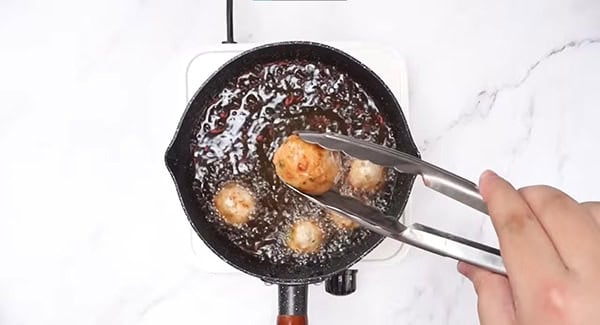Fry the chicken meatballs until golden brown. 