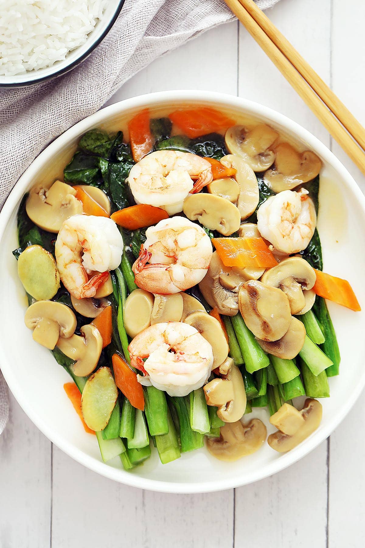 Choy sum with shrimp and mushroom on a plate. 