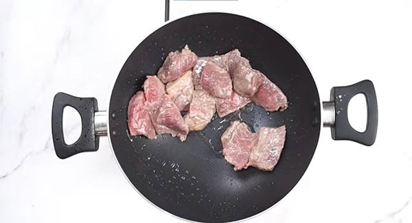 Cook the beef until half-cooked. 
