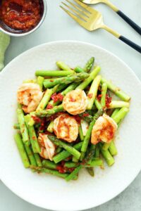 Sambal asparagus served on a plate.