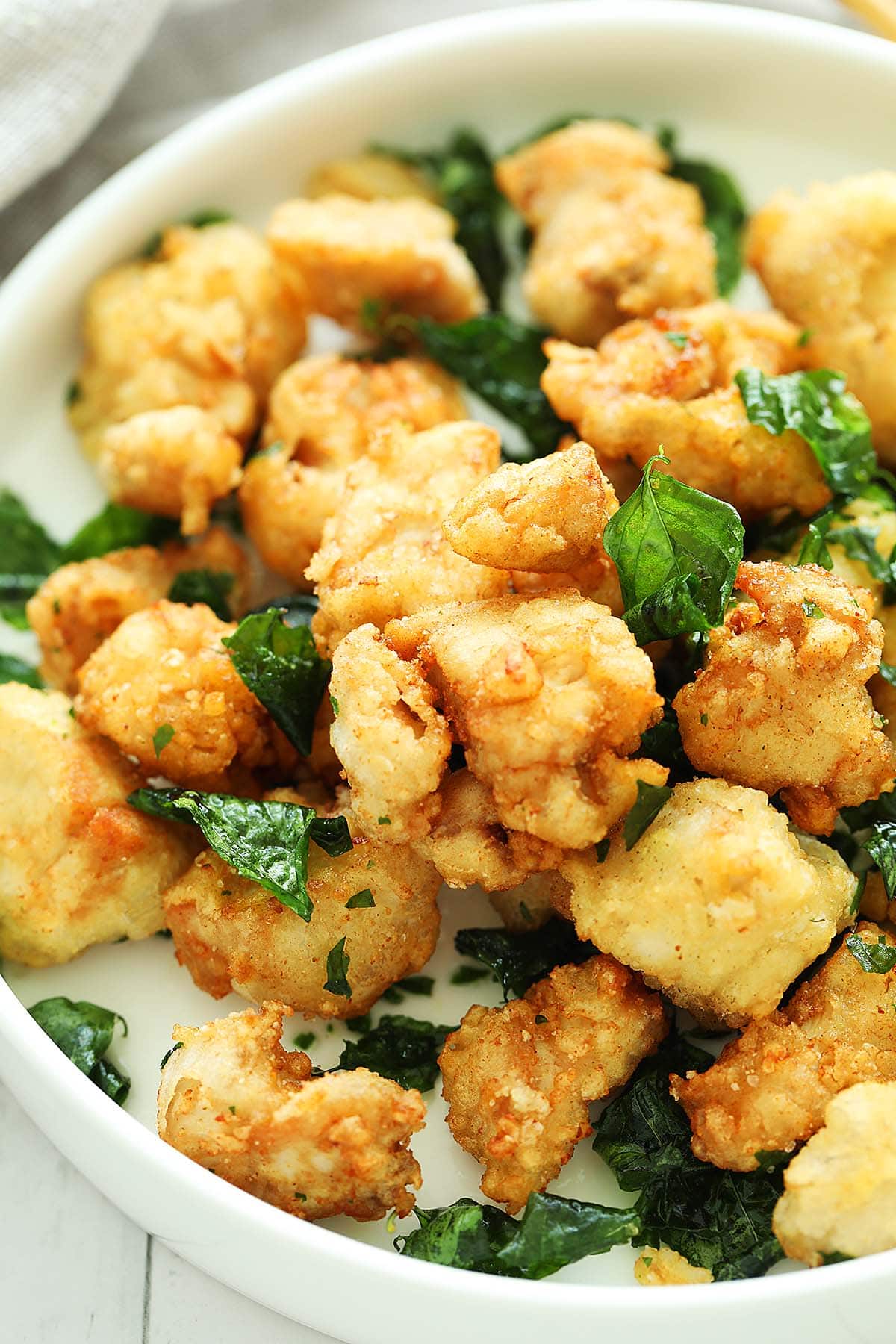 Crispy nuggets of Asian popcorn chicken dusted with pepper salt. 