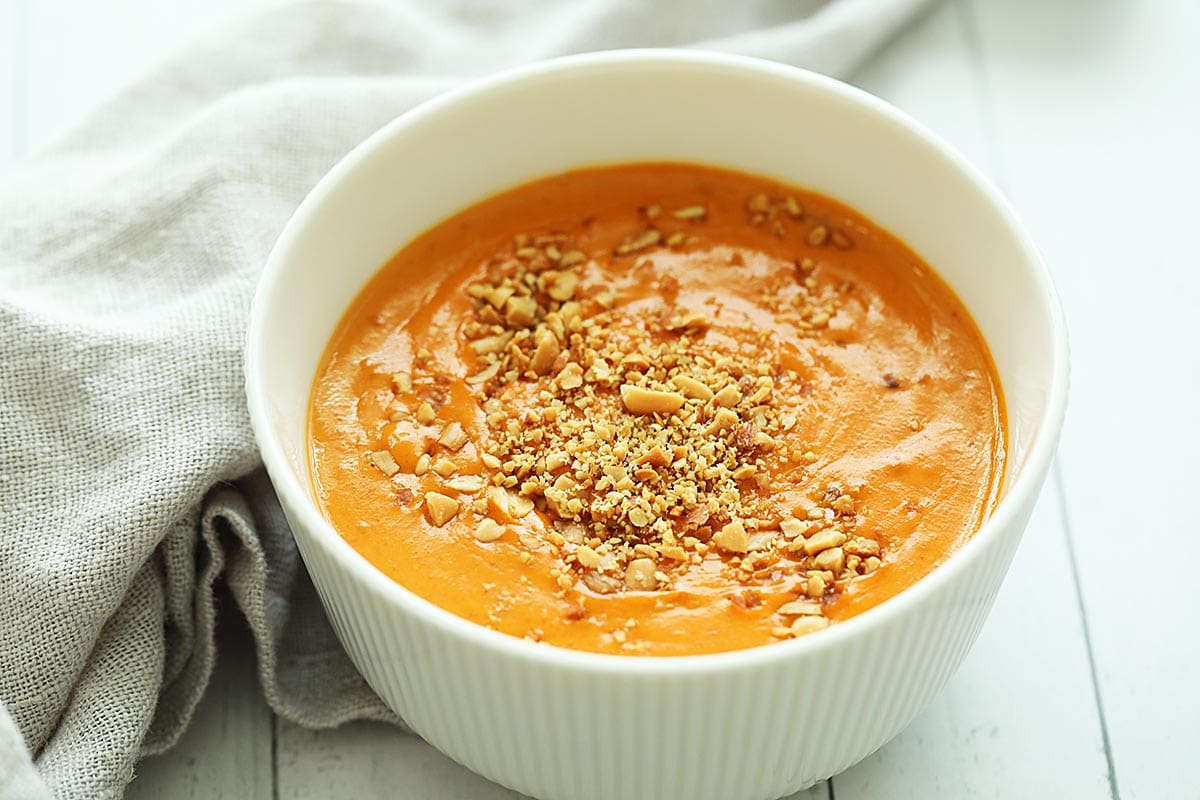 Thai peanut sauce with coconut milk topped with ground peanuts. 
