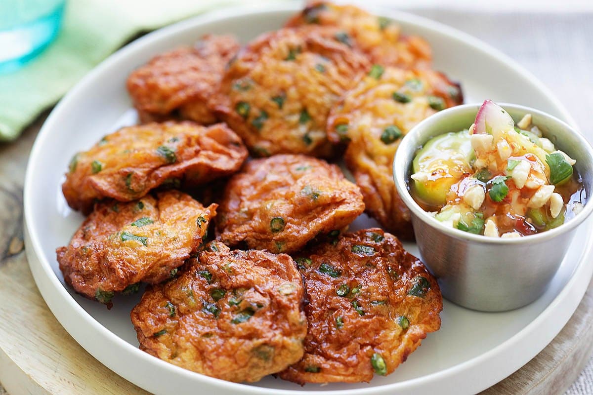 Golden brown fried Thai fish cakes with cucumber salad as the dipping sauce. 