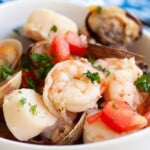 Seafood stew recipe with shrimp, scallops, mussels and clams.