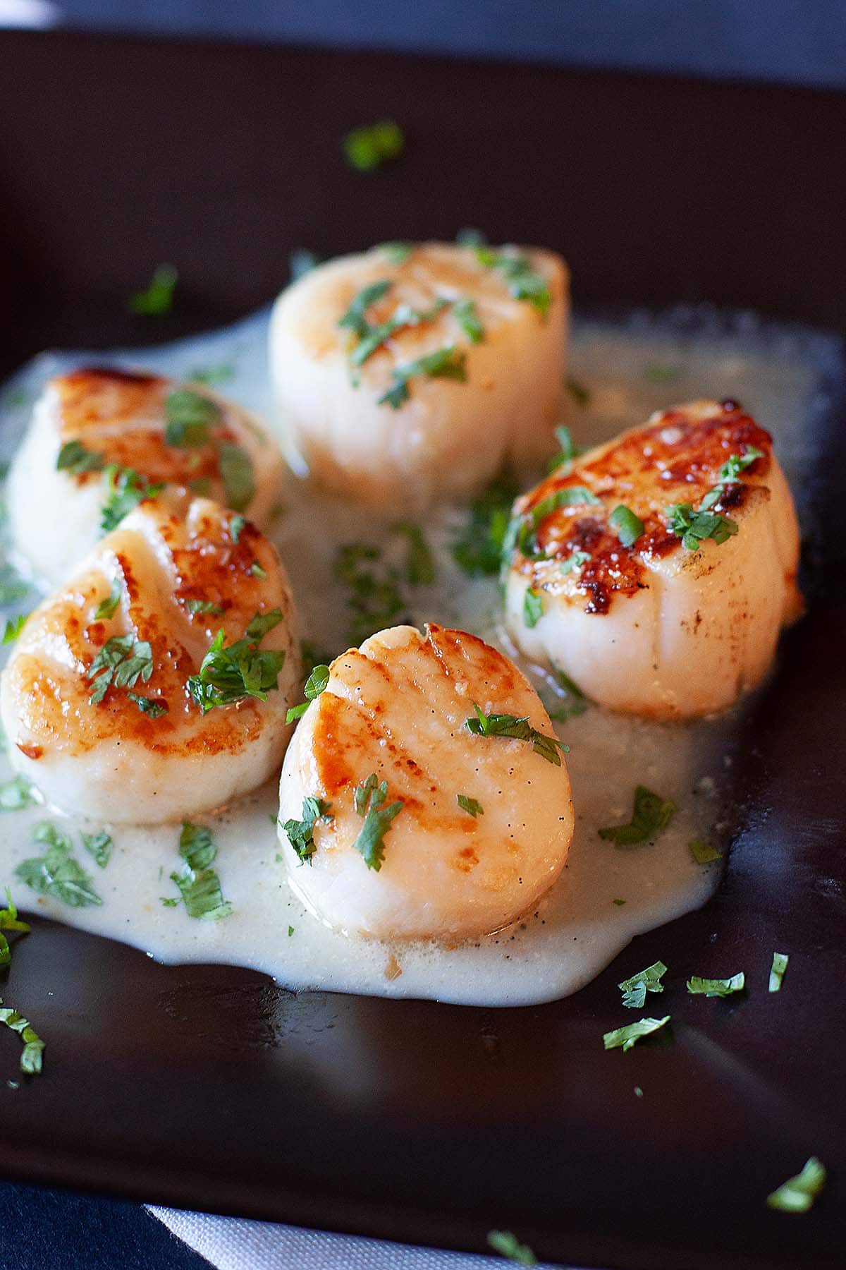 Perfect seared scallops with garlic and herb. 