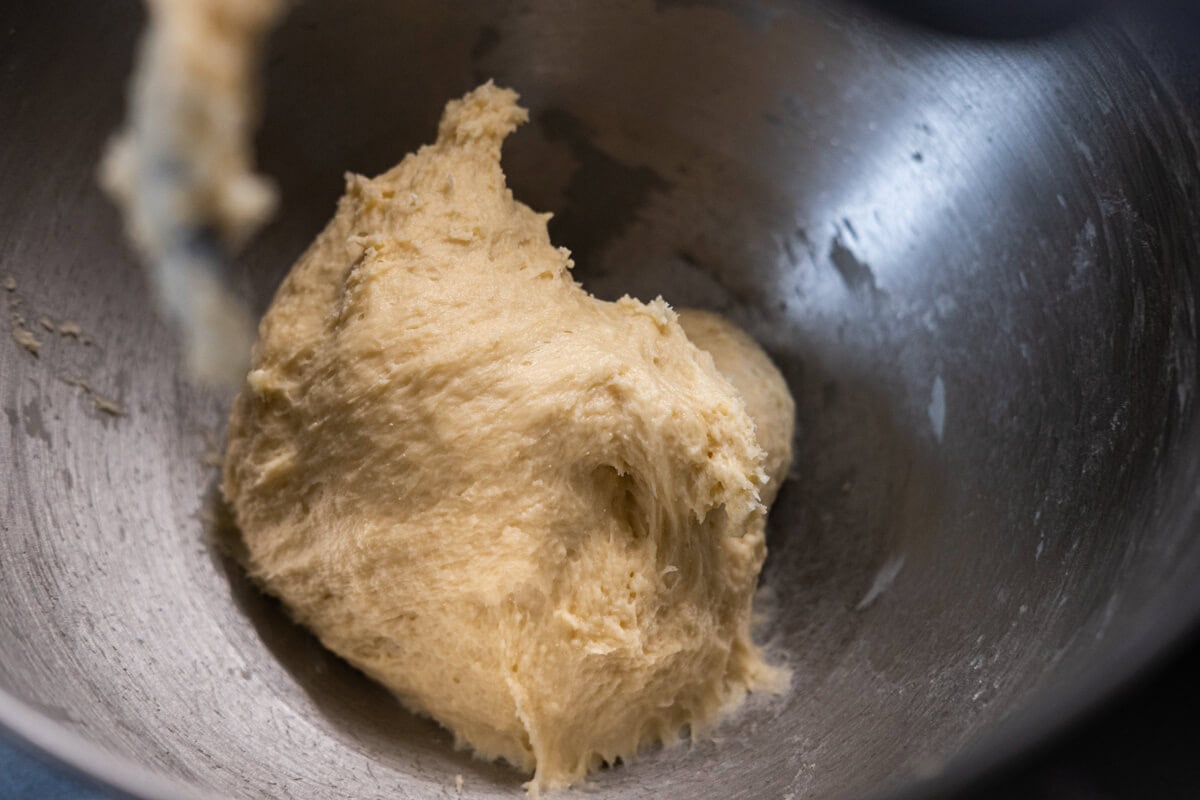 Mix the flour, sugar, salt, milk powder, and yeast until combined, then add the water and egg to the flour mixture  in a stand mixer. 