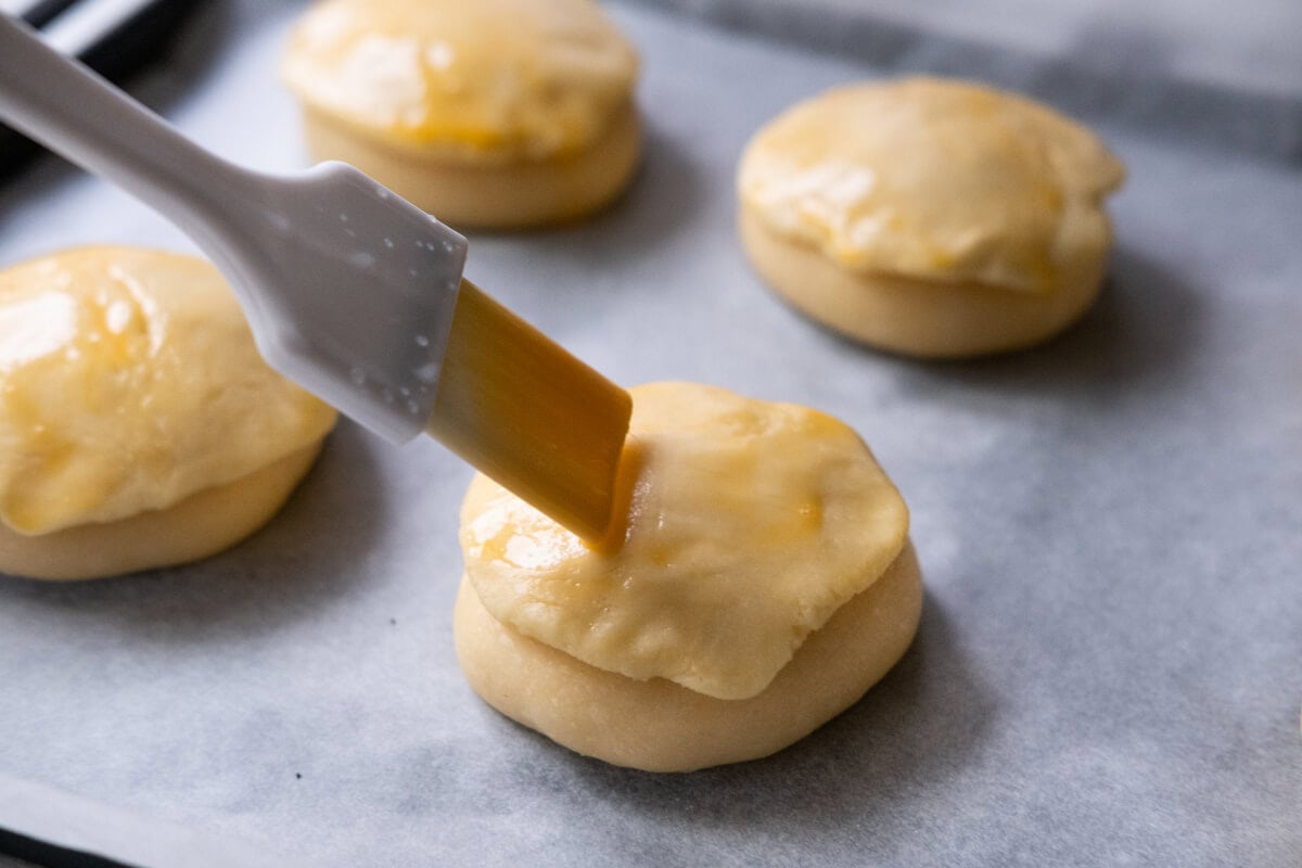 Brush the dough with egg wash. 