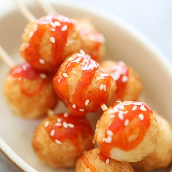 Fried cuttlefish balls threaded on a bamboo skewer.