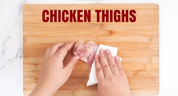 Pat dry the chicken thighs with paper towel.