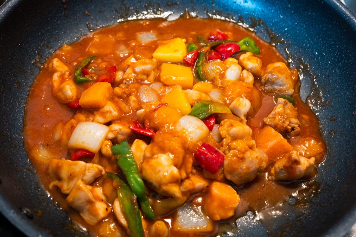 Mango chicken in a skillet.