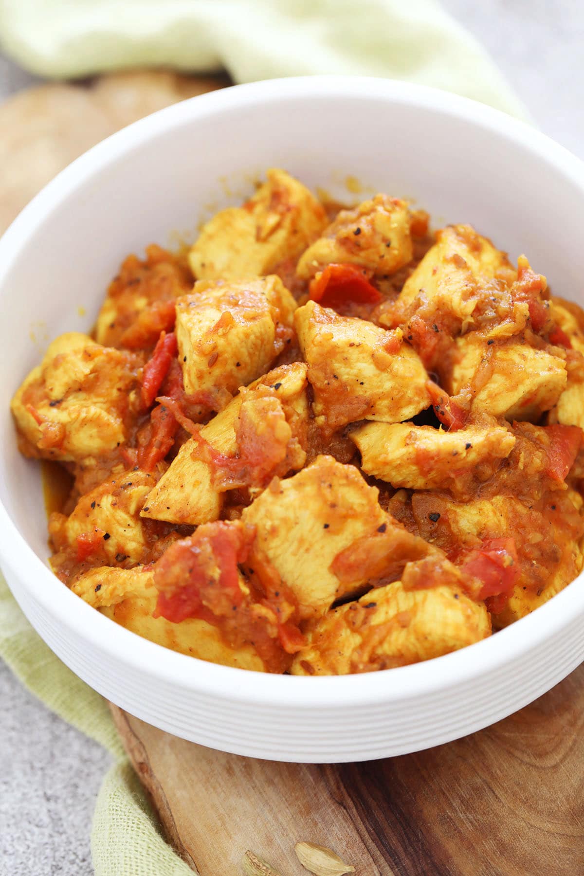 Authentic cardamom chicken served in a bowl.