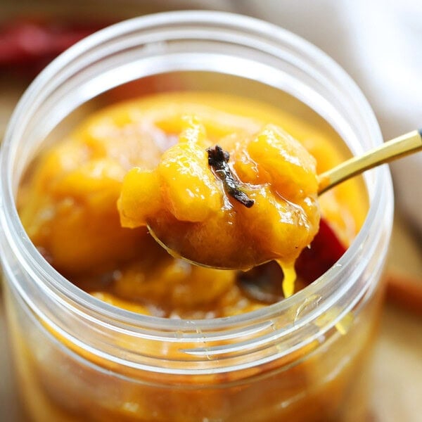 Sticky sweet Indian mango chutney in a jar.