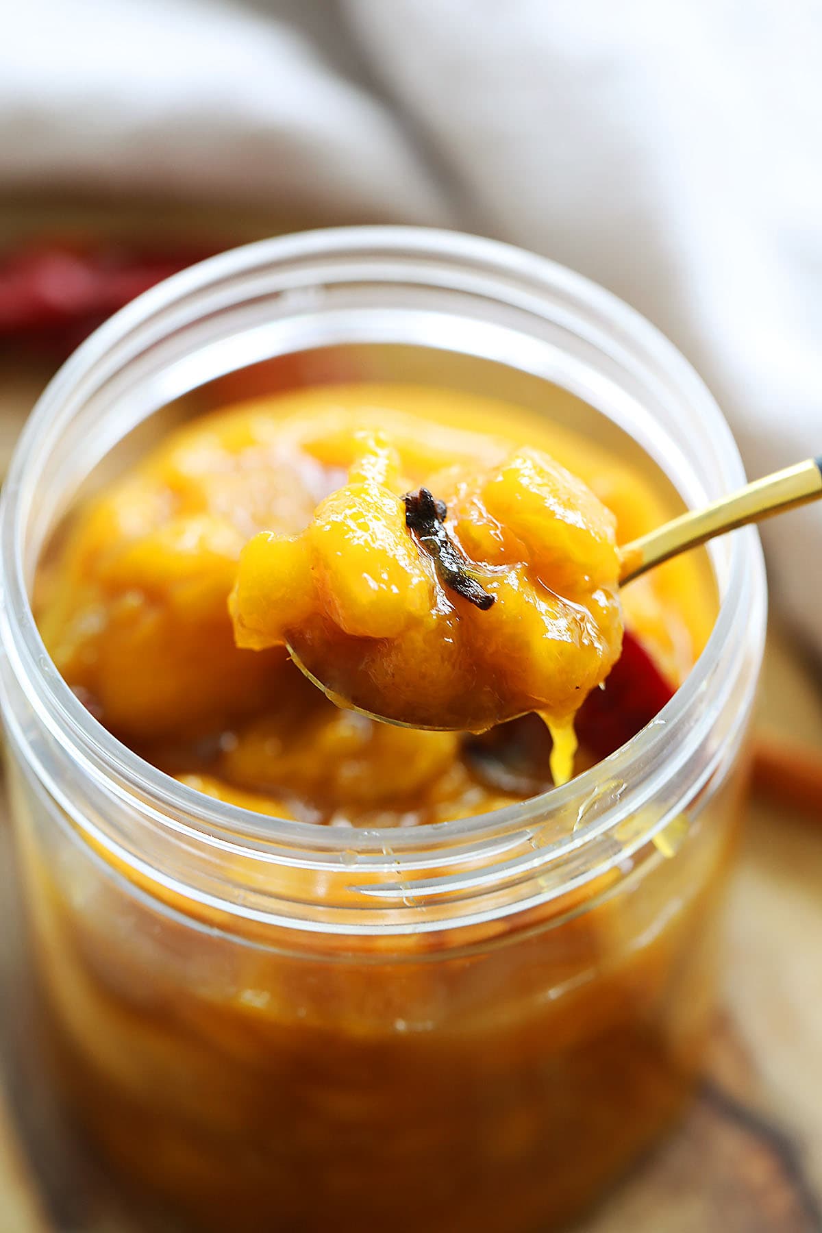 Sticky sweet Indian mango chutney in a jar.