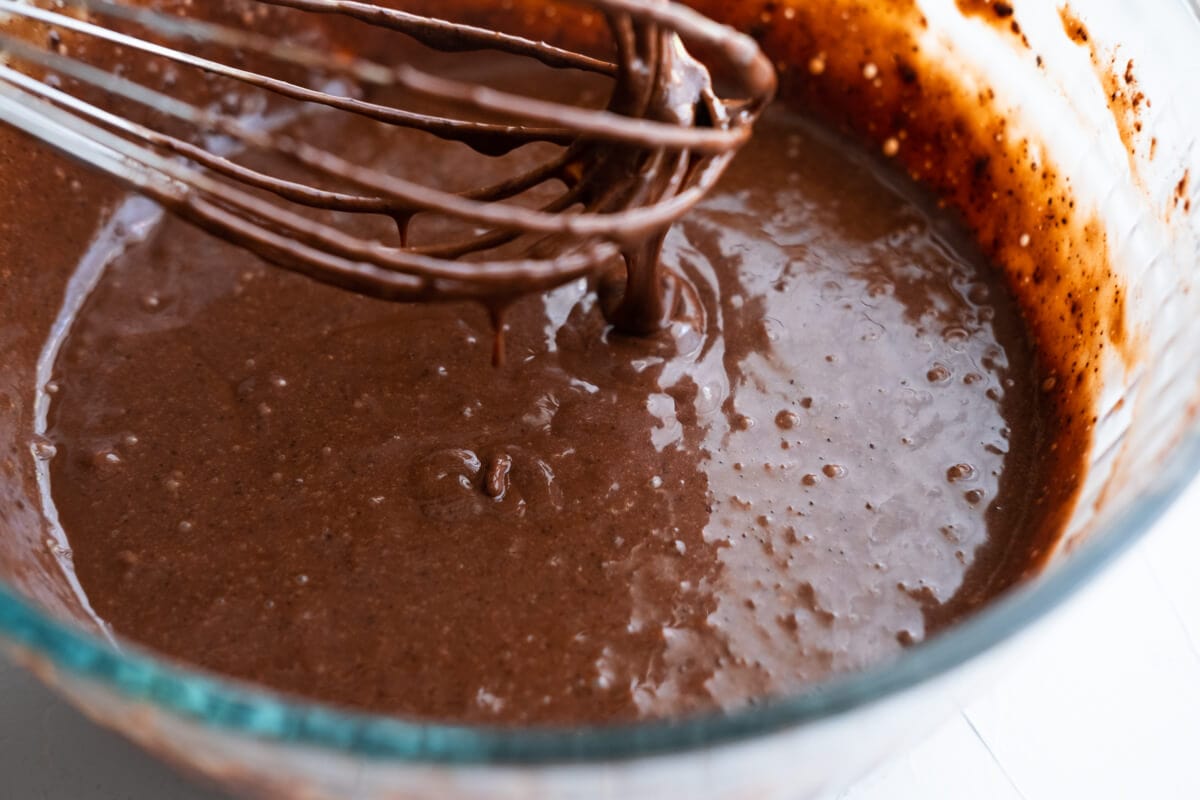 Whisk together the egg mixture with the flour in a large mixing bowl.  