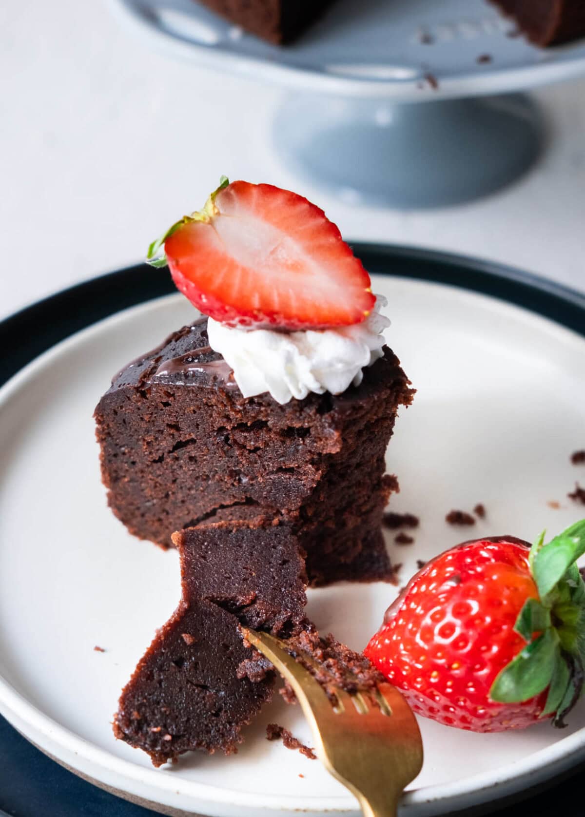 A slice of no bake chocolate cake served on  a plate. 