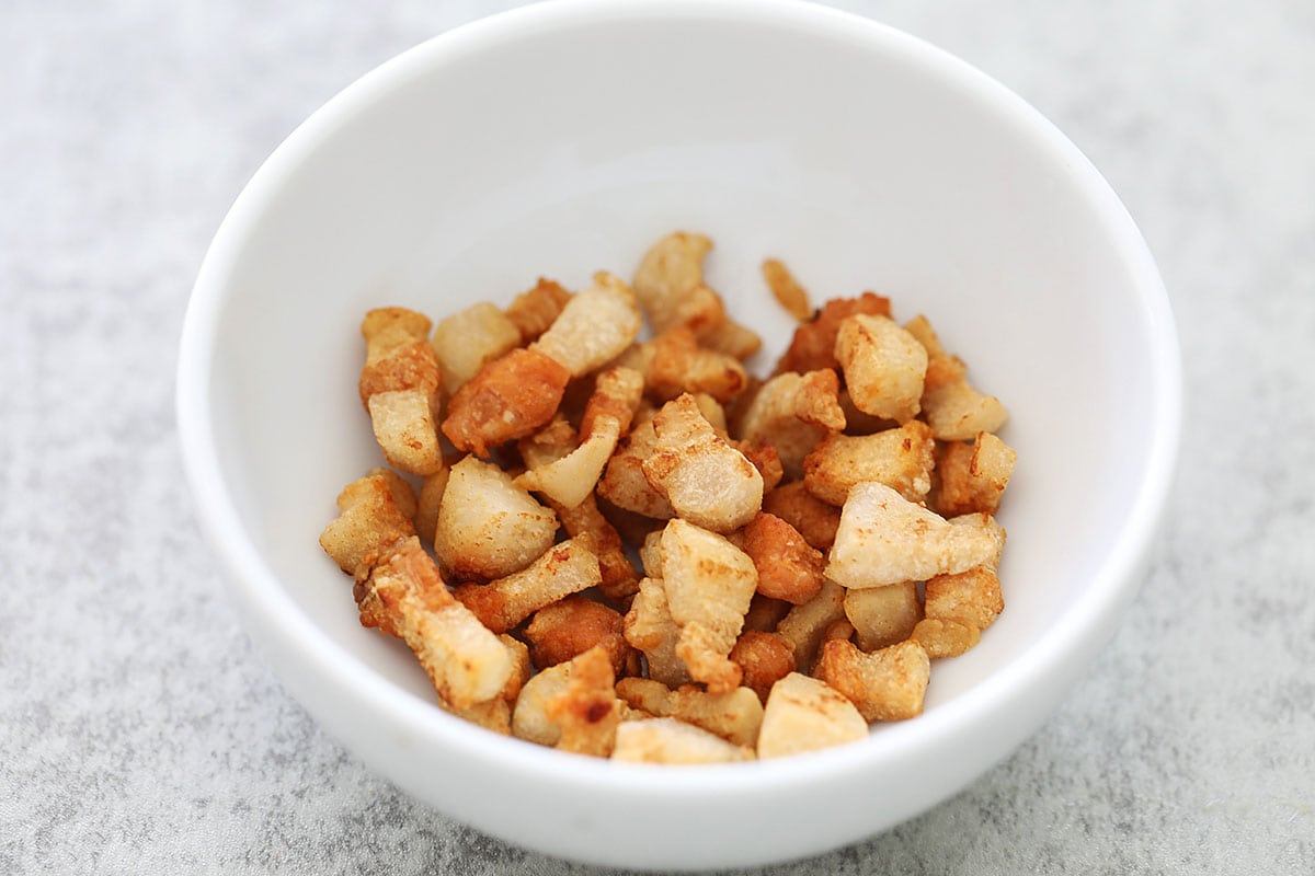 Crispy pork lard in a small bowl.