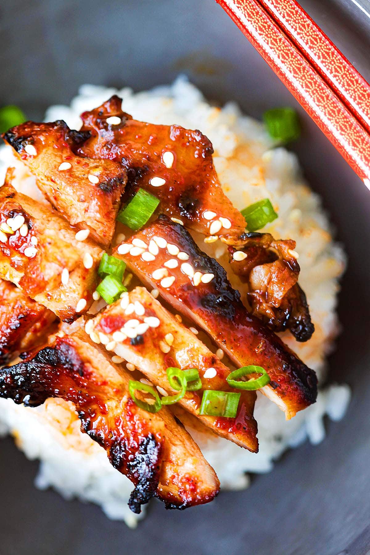 Grilled boneless spicy Korean chicken served on a plate.