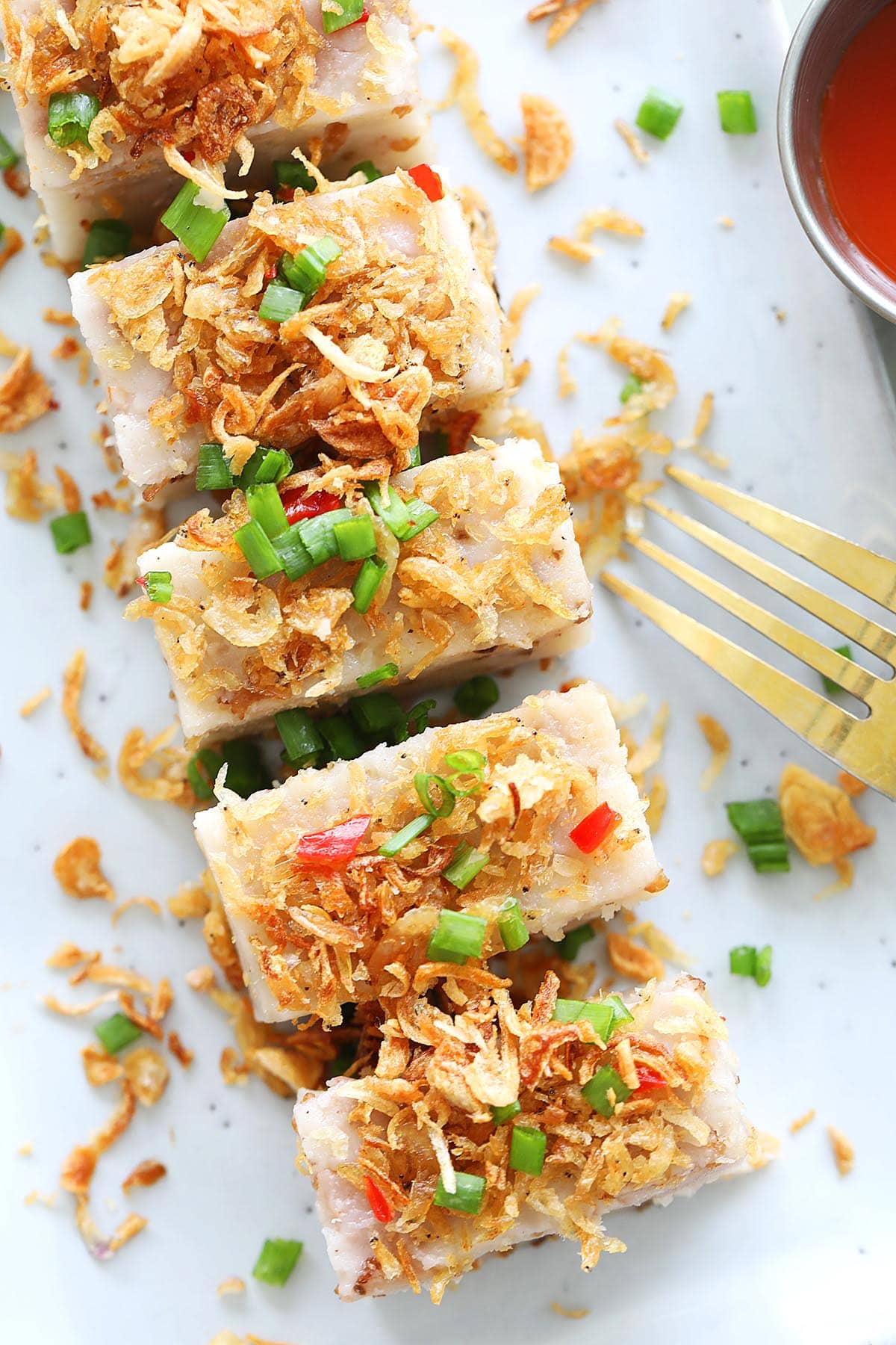 Chinese steamed yam cake served with chili sauce.