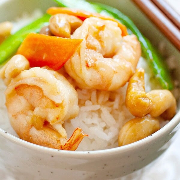 Shrimp with cashew nuts stir fry with carrots and snow peas.