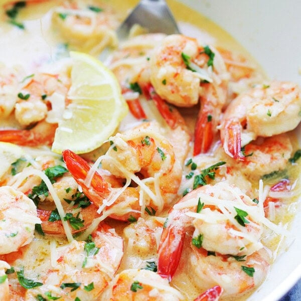 Easy garlic butter shrimp recipe with tail-on shrimp in creamy sauce.