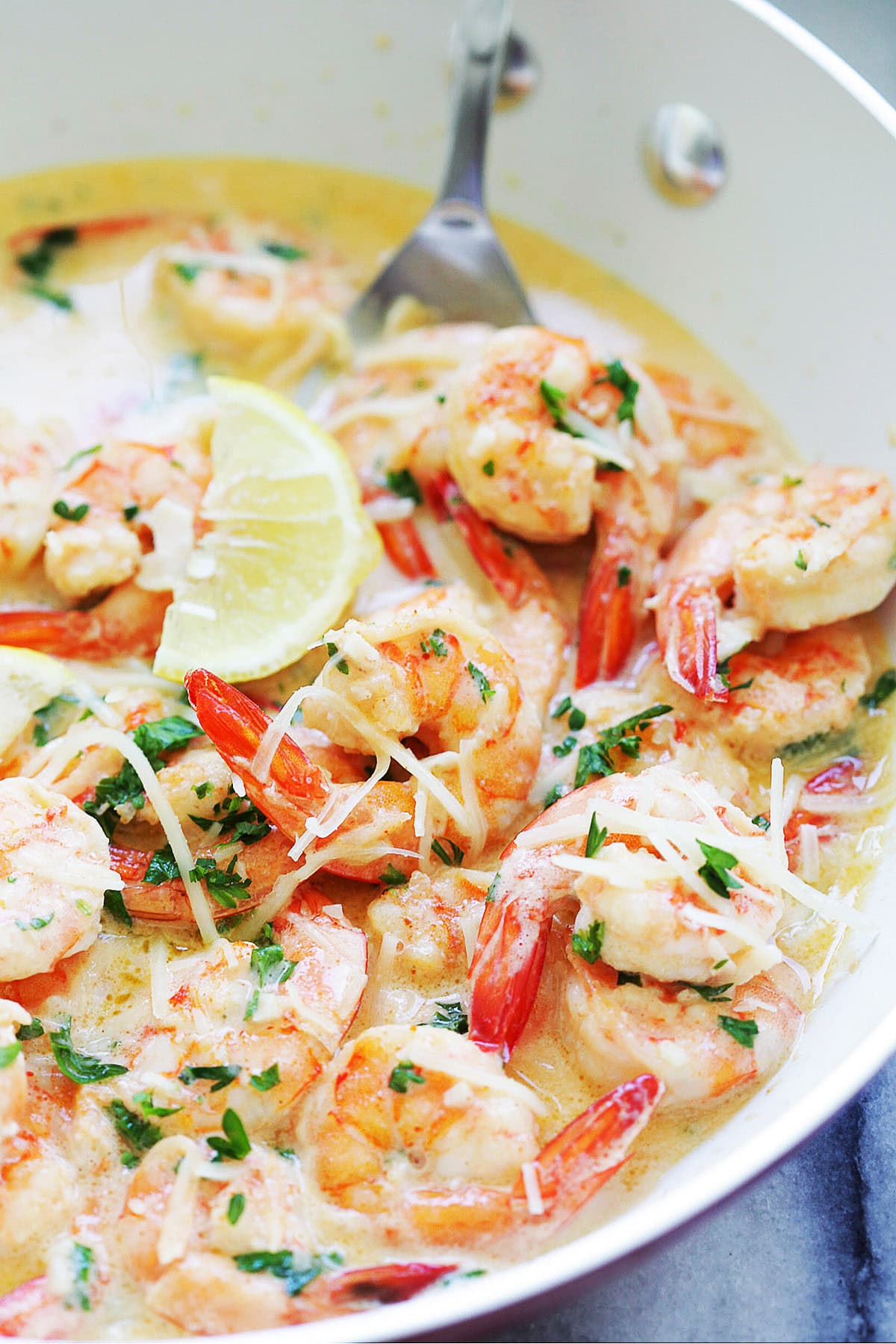 Easy garlic butter shrimp recipe with tail-on shrimp in creamy sauce.