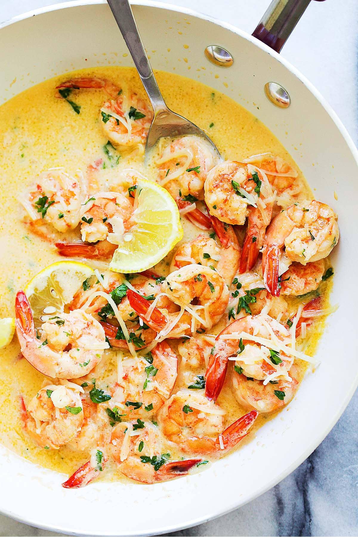 Garlic butter shrimp served in a skillet.