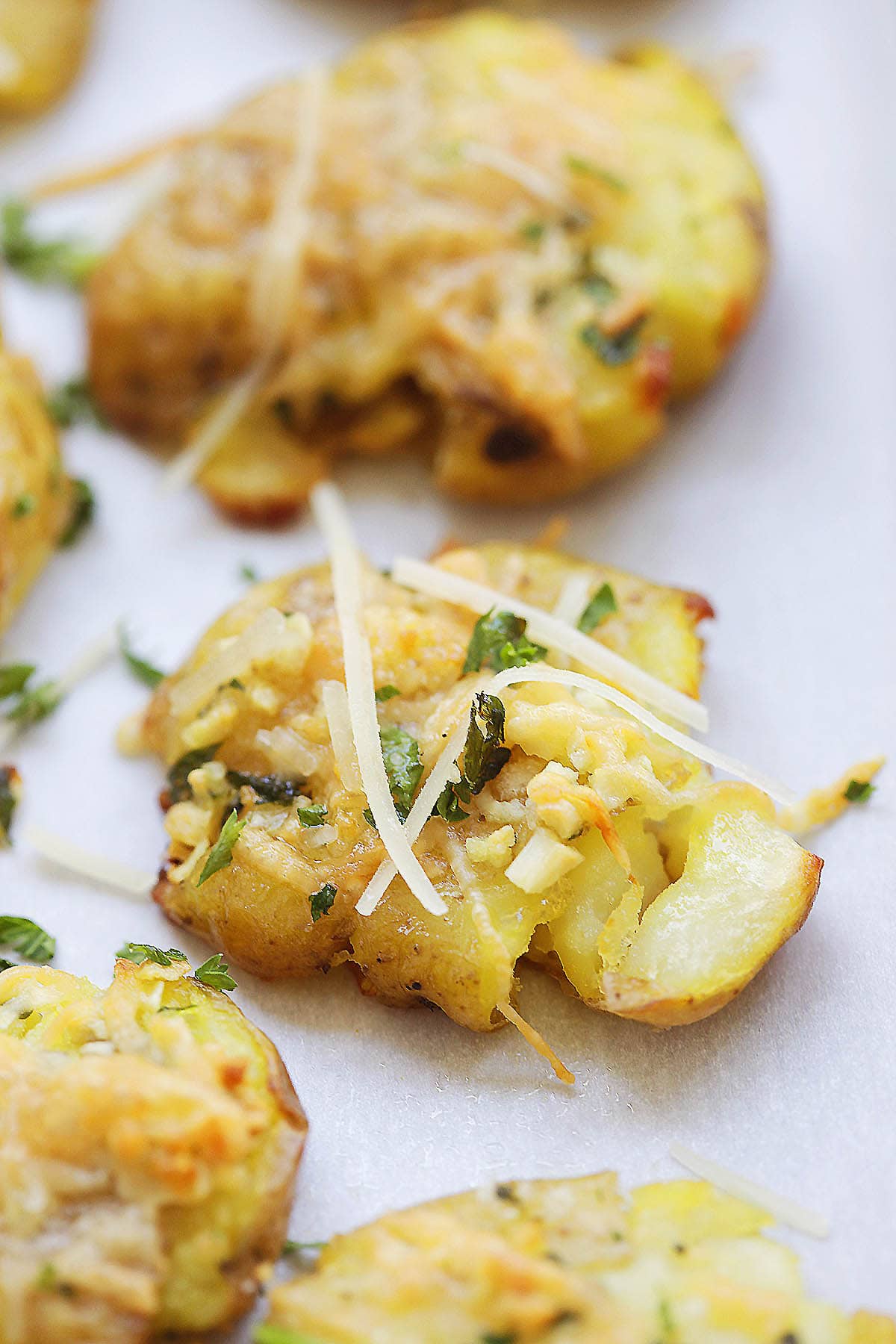 Crispy baby potatoes with garlic butter, melted Parmesan, and a sprinkle of fresh parsley.