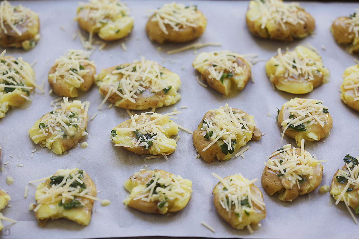 Potatoes brushed with a garlic butter mixture and topped with Parmesan cheese.