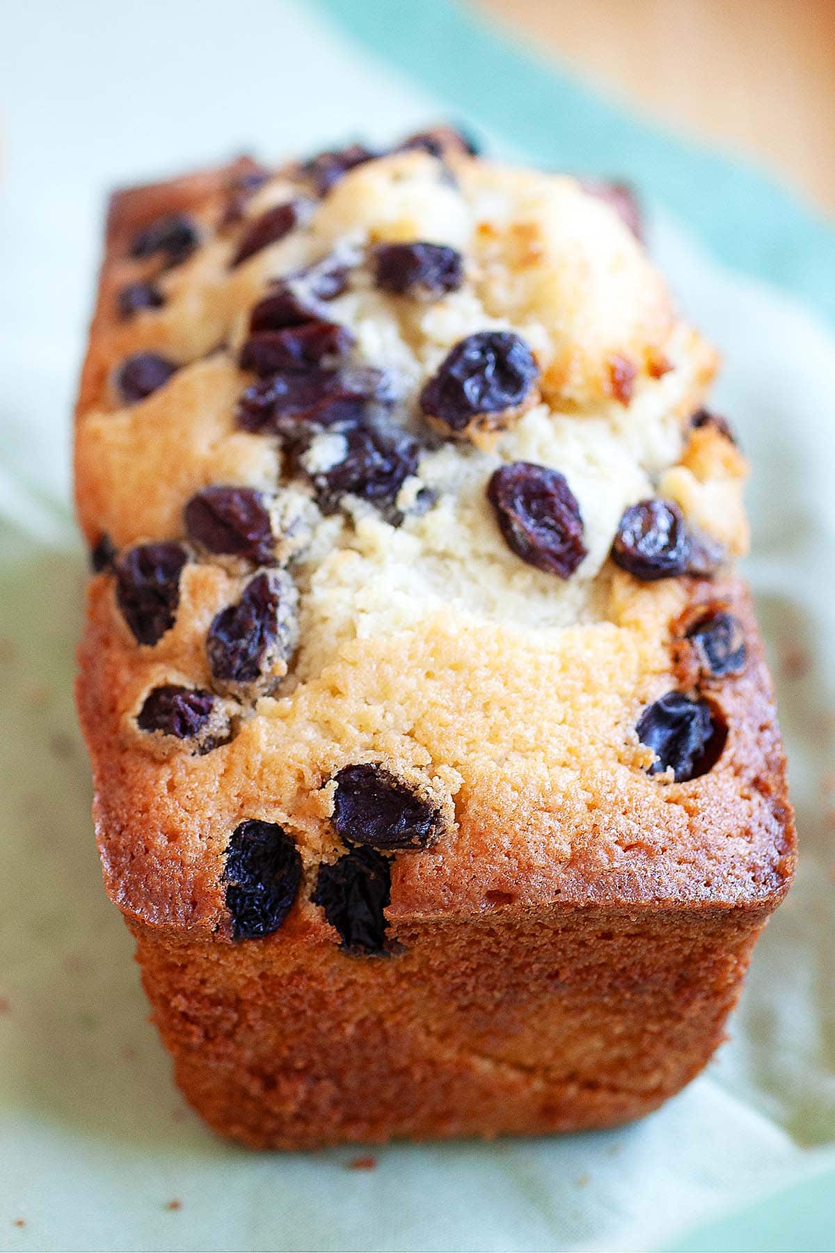 A loaf of cake with raisins.