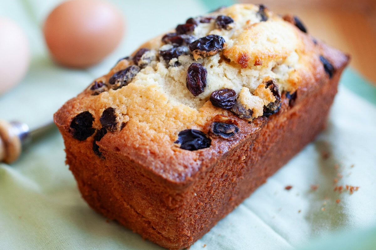 Moist raisin cake topped with lots of raisins.