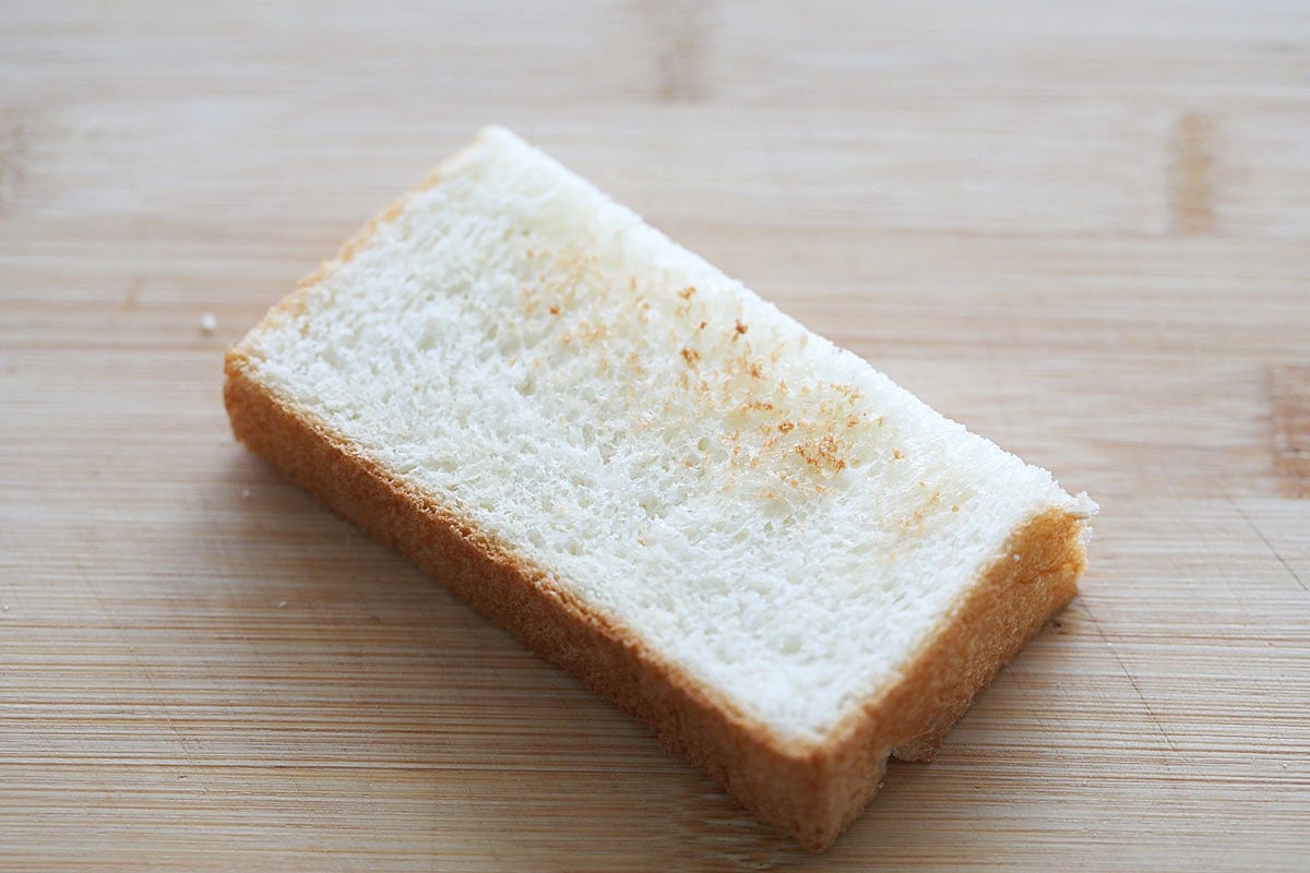 A slice of toasted white bread.