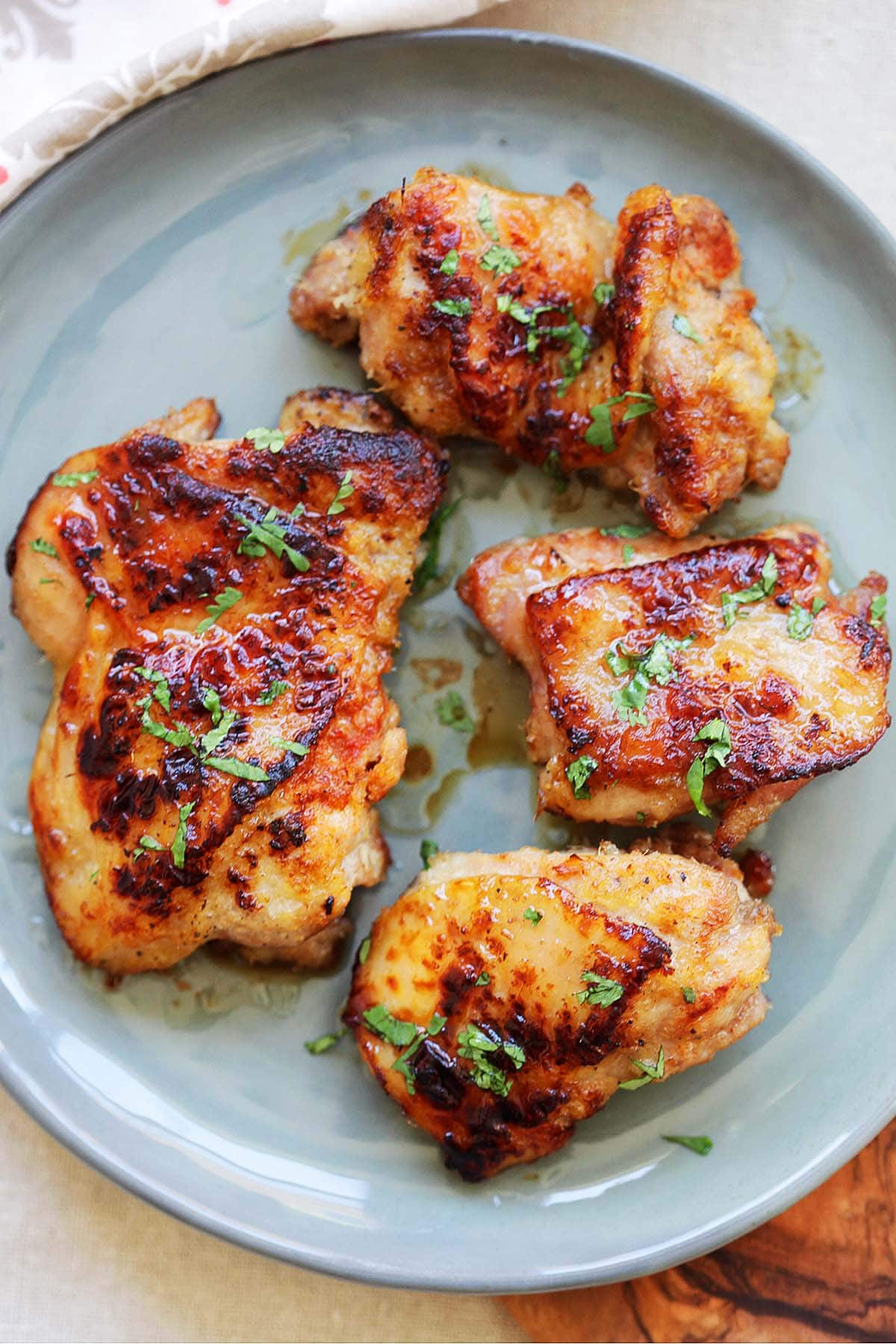 Lemongrass chicken served on a plate, garnished with fresh parsley.