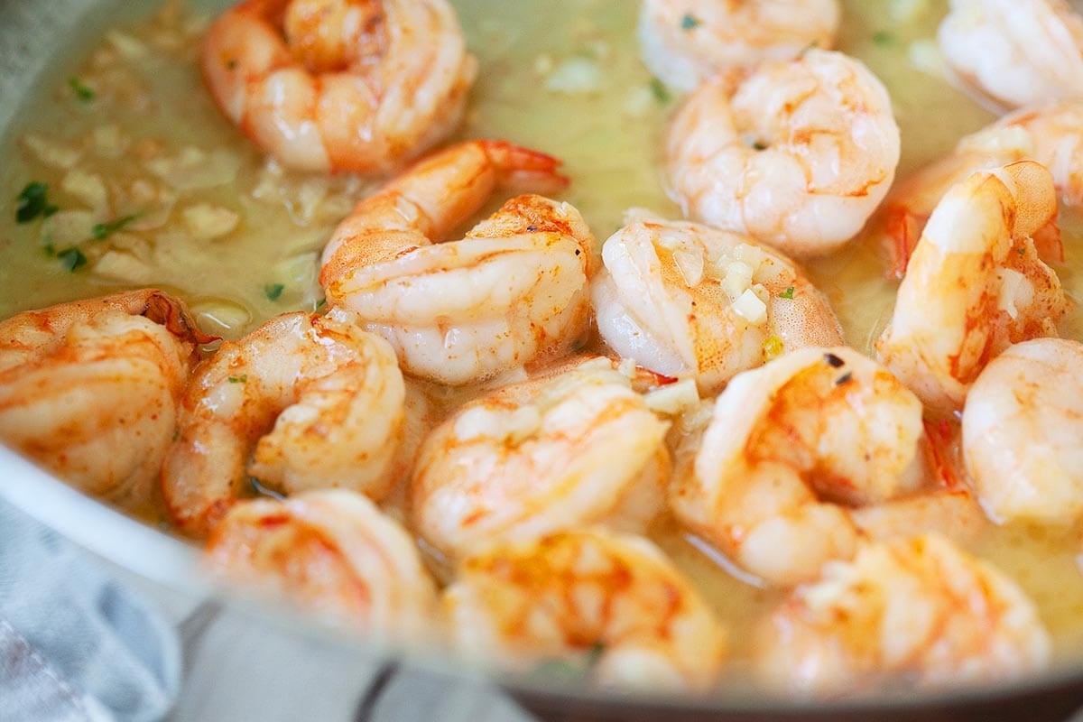 Jumbo shrimp and buttery garlic sauce in a pan.