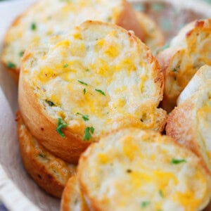 Texas Toast served in a basket, golden and cheesy.