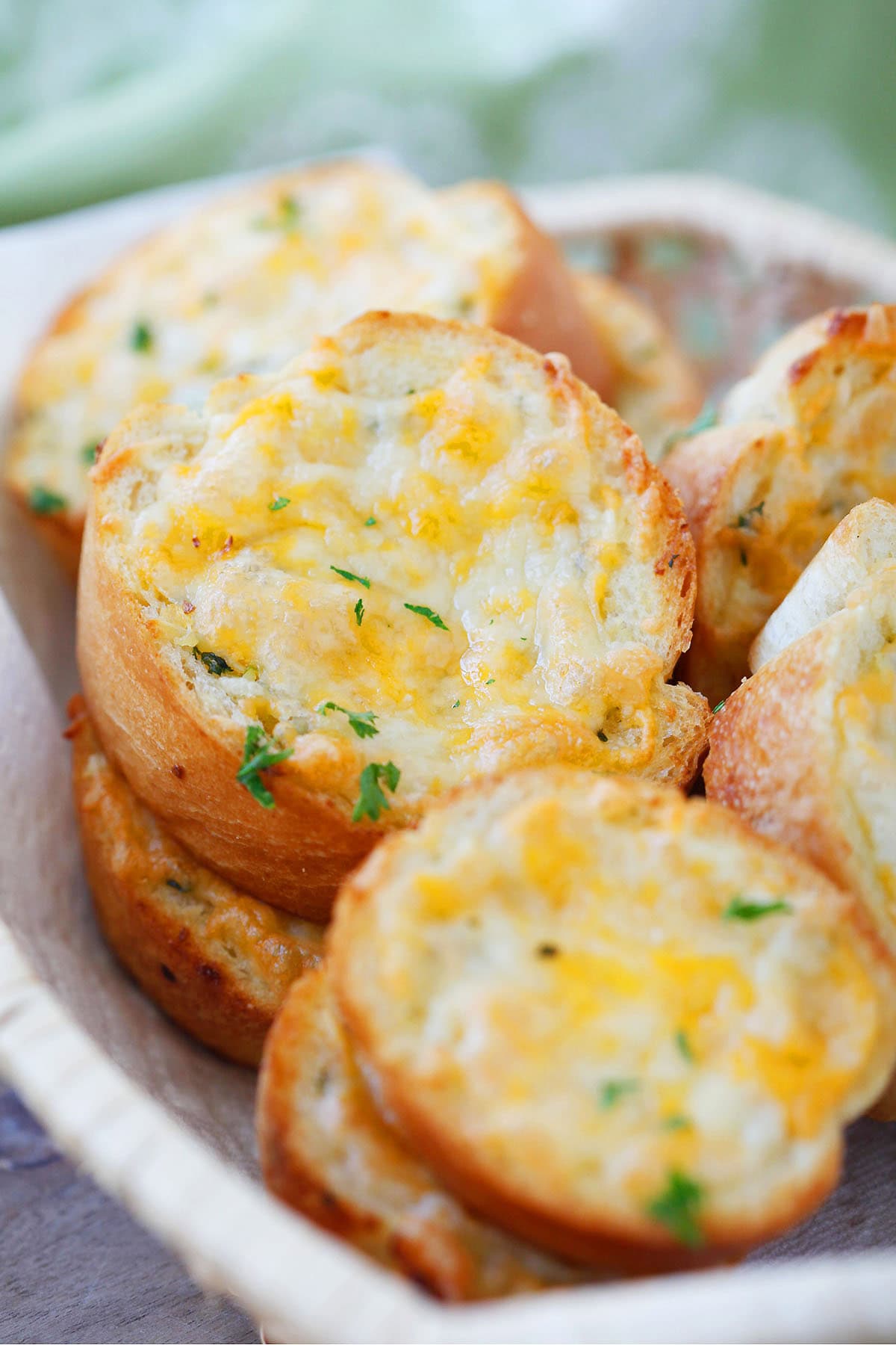 Texas Toast served in a basket, golden and cheesy.