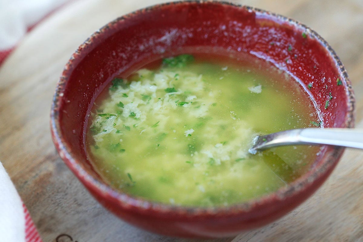 A mixture of garlic, butter, and parsley in a bowl.