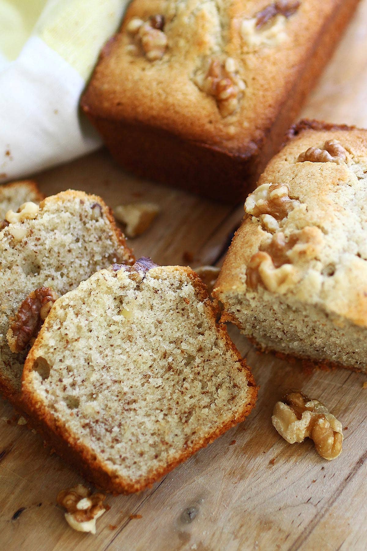 Walnut cake sliced into pieces.